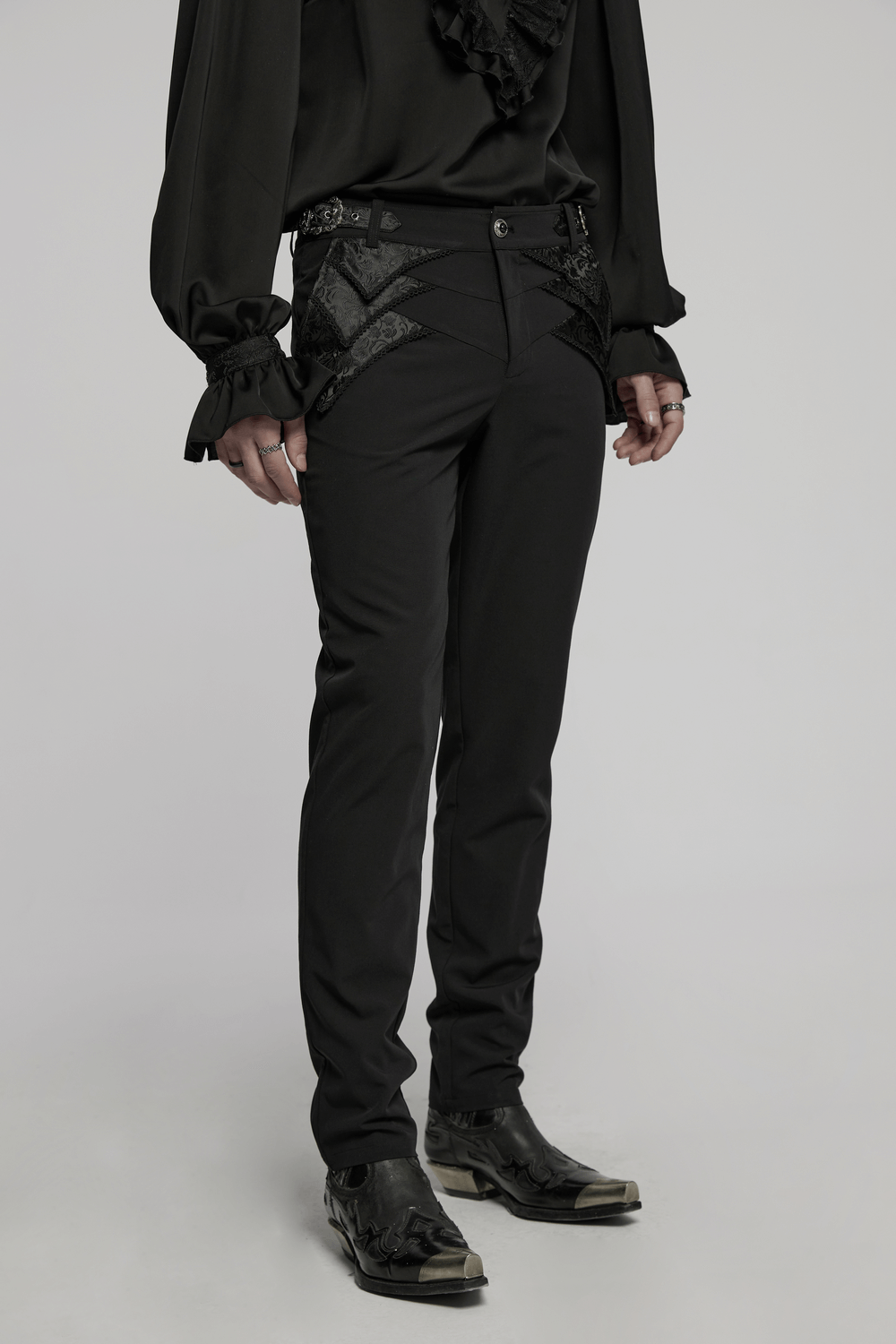 Gothic black trousers with lace detail and adjustable waist, styled with a ruffled shirt and stylish shoes.