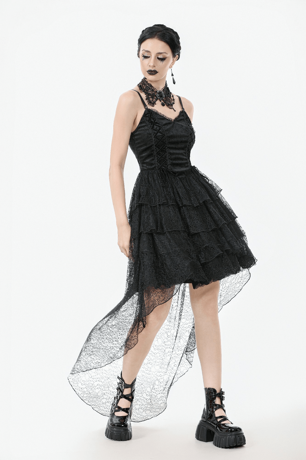 Elegant gothic black lace dress with corset bodice and layered high-low hemline for alternative fashion lovers.