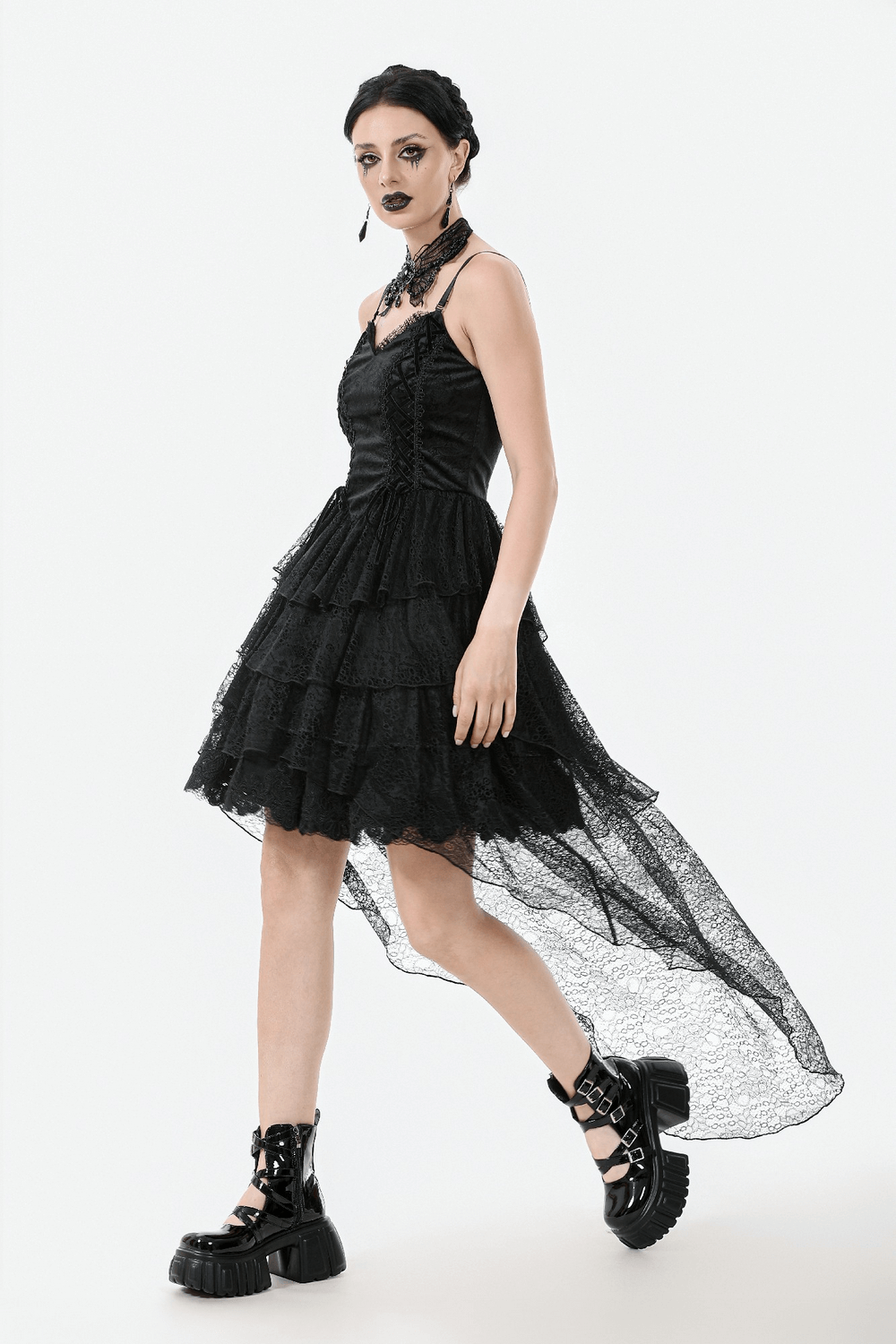 Gothic black lace dress with corset bodice, layered tiers, and high-low hem for a dramatic look.