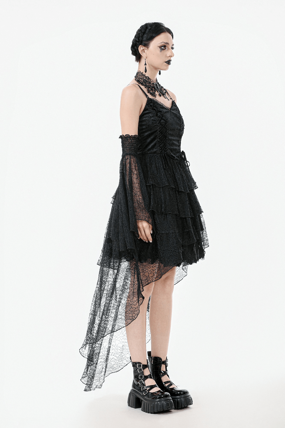 Gothic black lace dress with corset bodice and tiered skirt, featuring spaghetti straps and a dramatic high-low hemline.