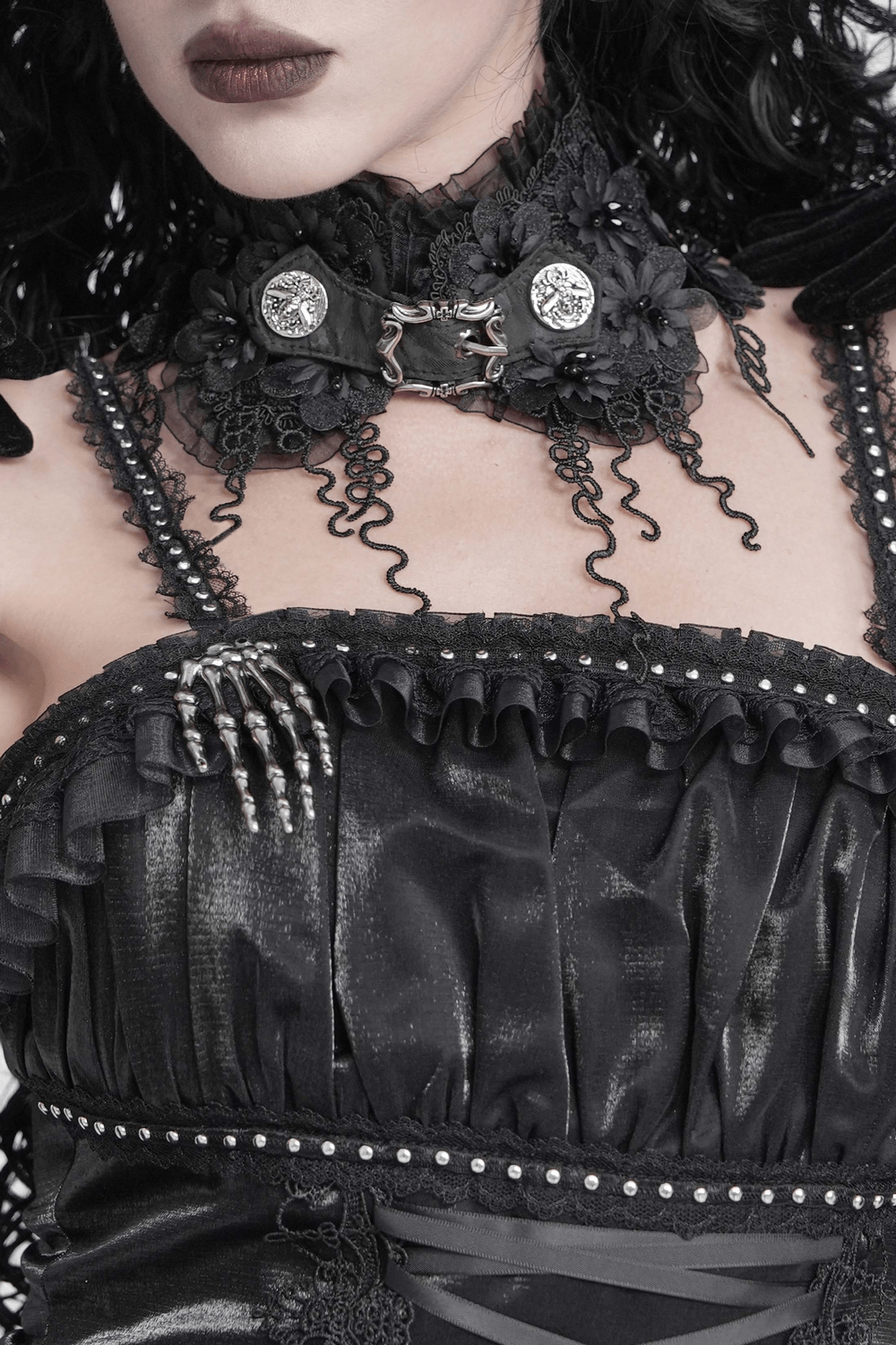 Gothic Black Lace Floral Choker with Silver Clasps worn with a dramatic black velvet dress, showcasing intricate lace and metal details.