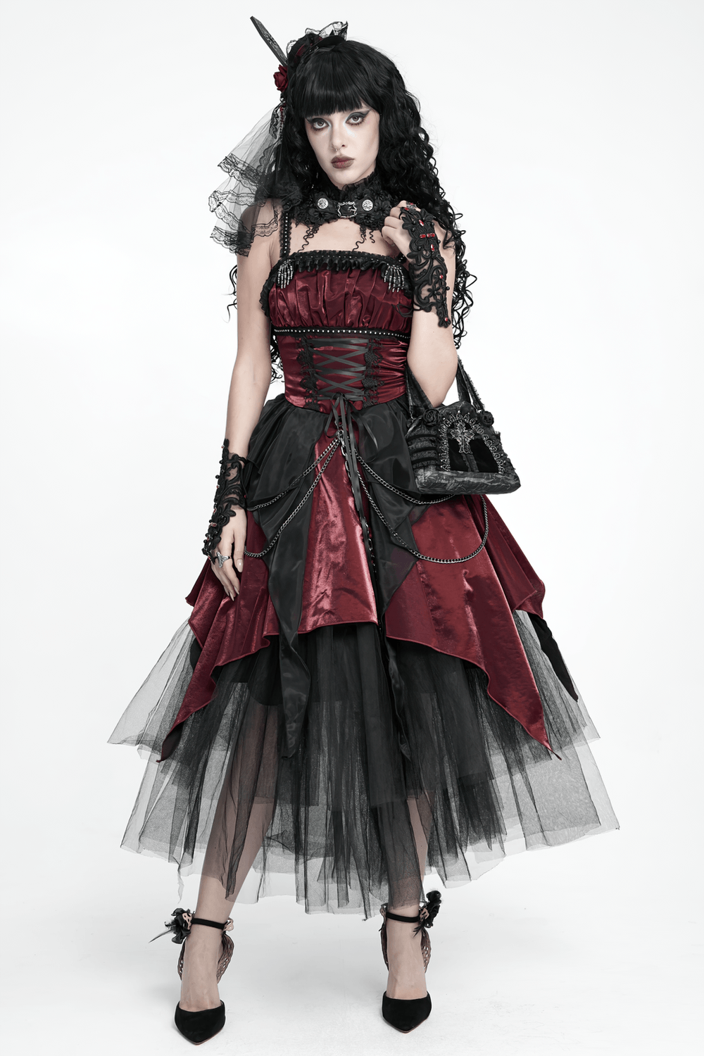 Gothic Black Lace Handbag with Cross and Rose Details showcased with a dramatic gothic dress and accessories.