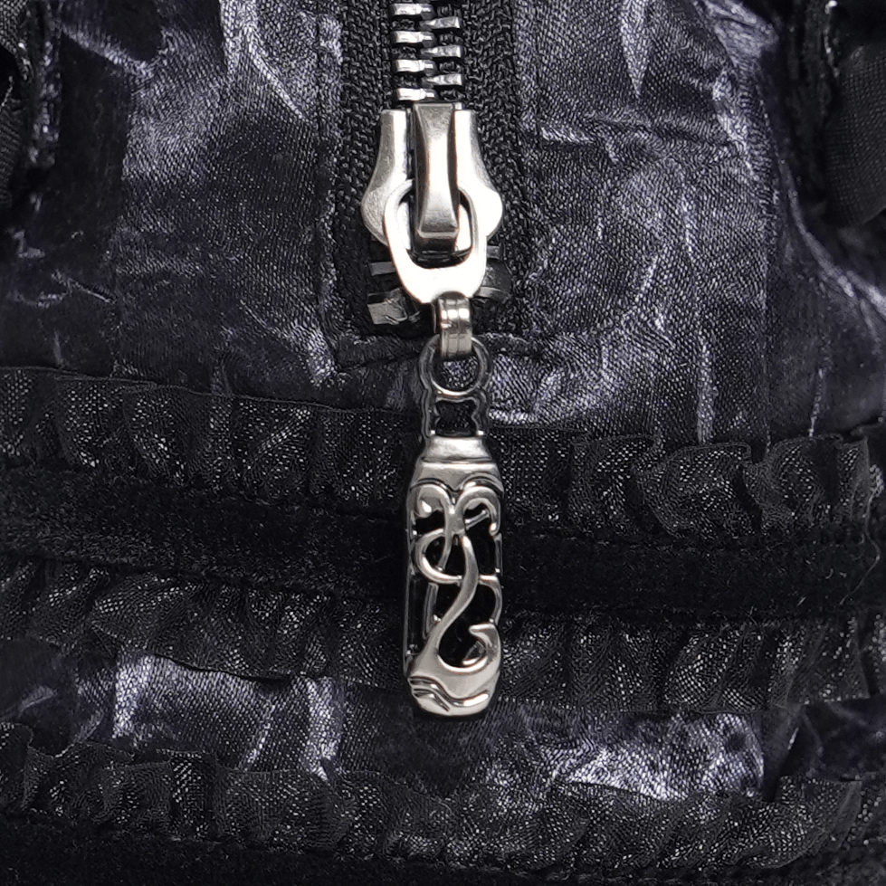 Gothic Black Lace Handbag with Cross and Rose Details zipper close-up with ornate charm decoration.