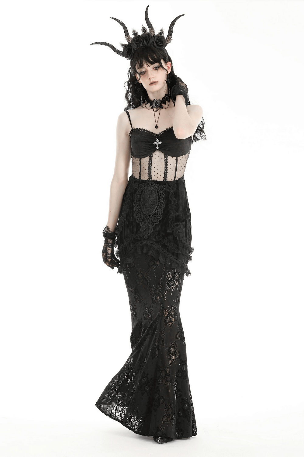 Elegant woman in Gothic black lace layered long skirt and corset, showcasing gothic fashion with intricate details and accessories.