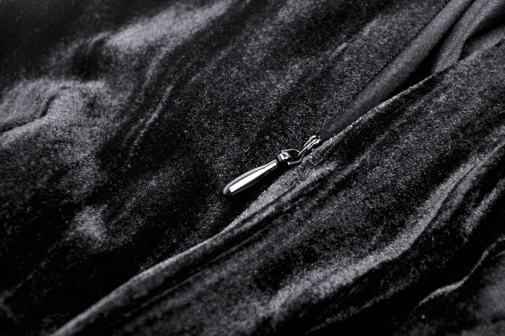 Close-up of the elegant velvet texture and zipper detail of a Gothic black skirt for women.