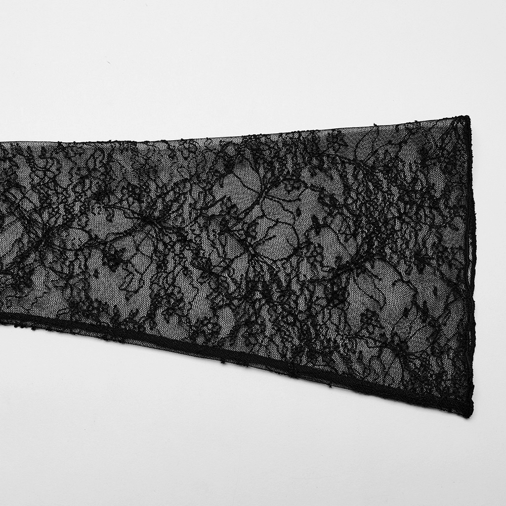 Close-up of gothic black lace fabric featuring intricate floral patterns for flared sleeves.