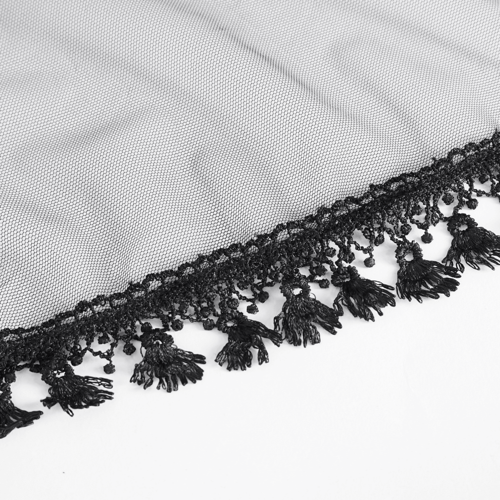 Close-up of elegant black lace fabric with intricate fringe detailing, perfect for gothic-inspired fashion.