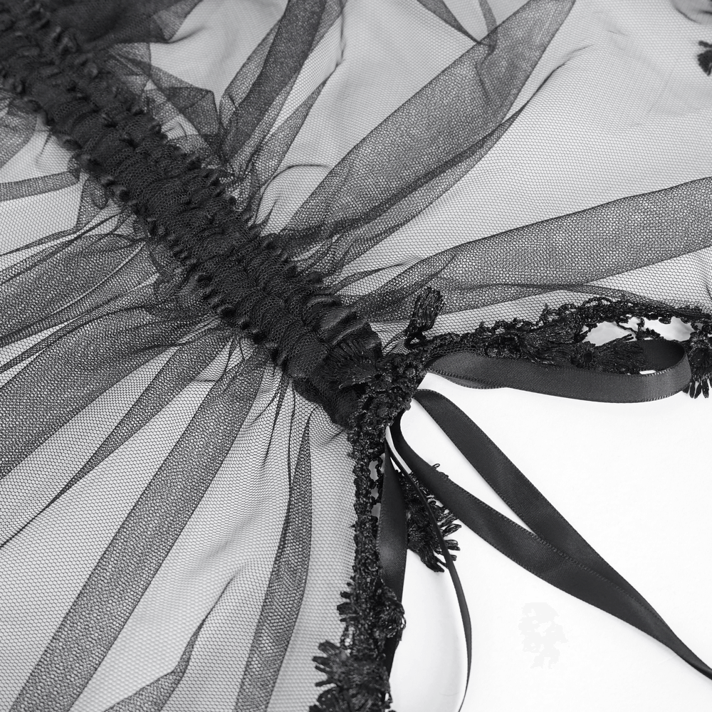 Close-up of black lace detailing and satin ribbons on a gothic maxi skirt, showcasing its elegant design.