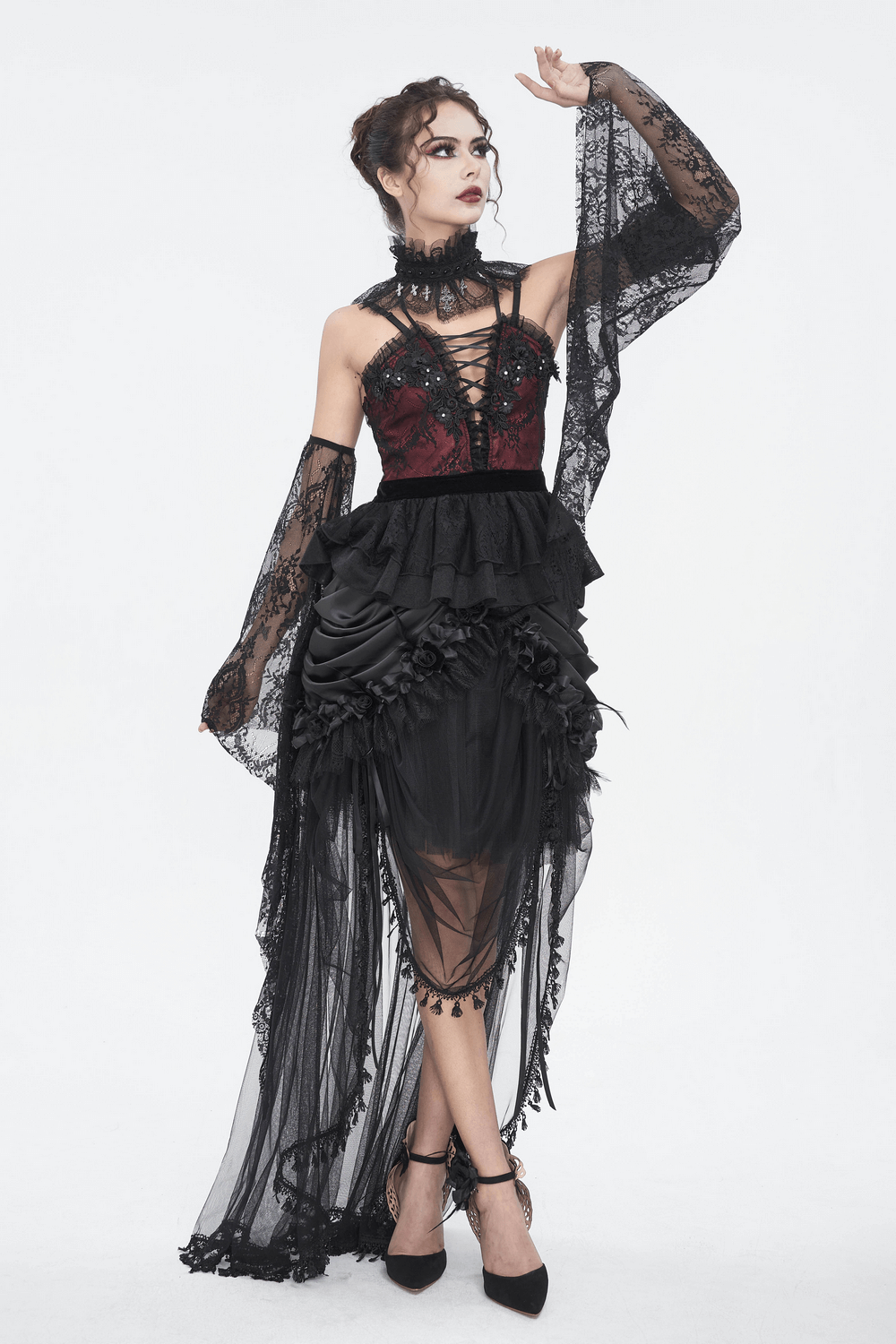 Elegant model in a Gothic lace maxi skirt, showcasing ruffles and a dramatic silhouette, perfect for evening wear.