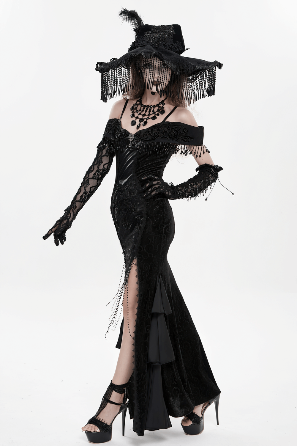 Gothic Black Lace Off-Shoulder Dress with Ruffles and Beads worn by a model with dramatic accessories.