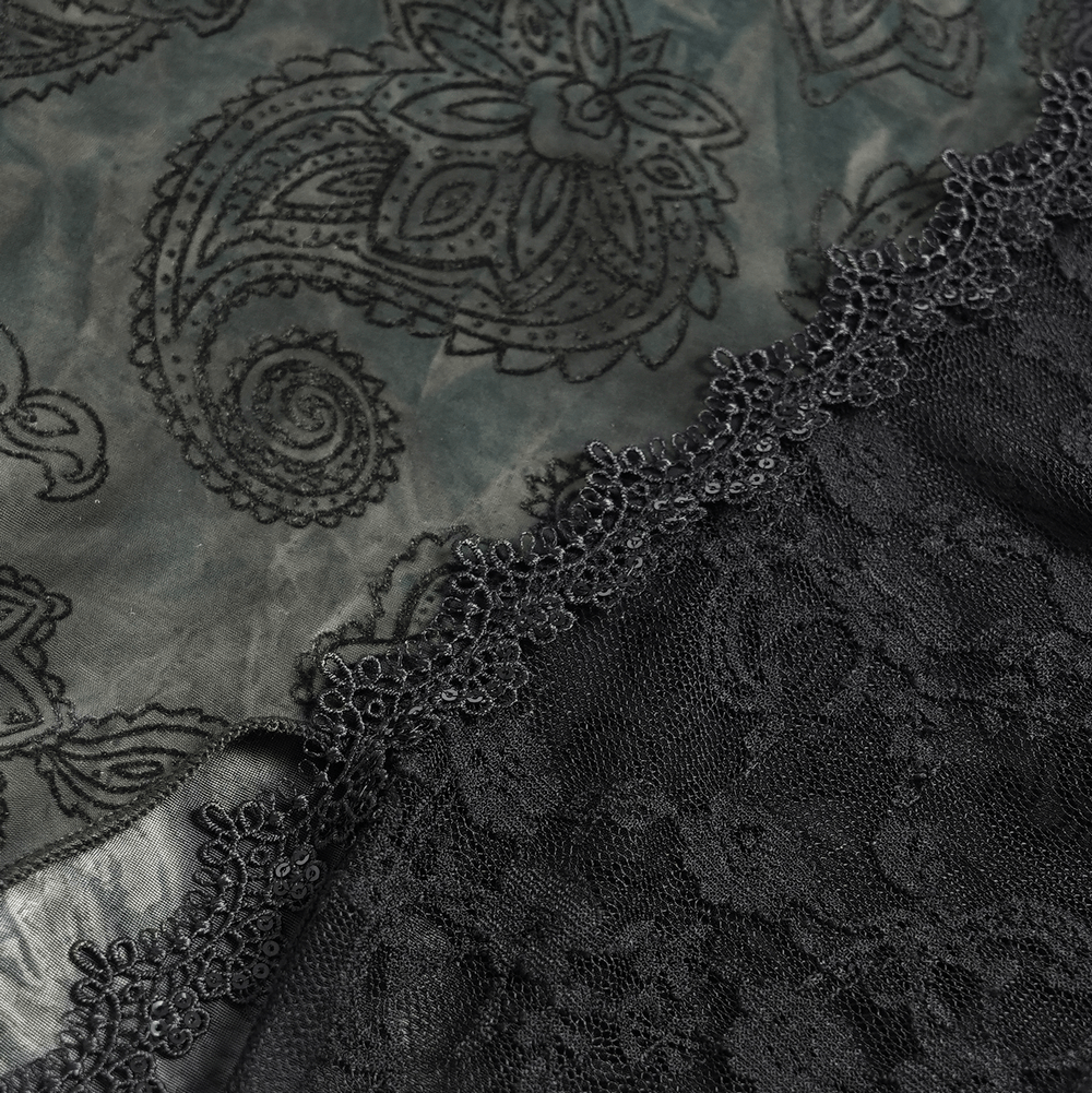 Close-up of black lace and paisley fabric, showcasing intricate textures for gothic fashion enthusiasts.