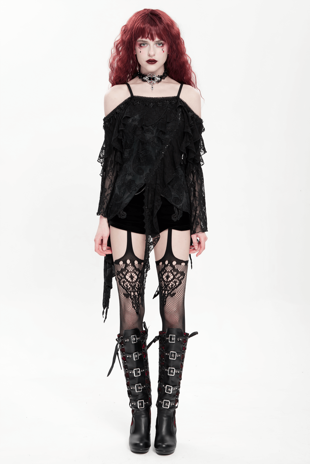 Model wearing a Gothic black lace off-shoulder top with flared sleeves, styled with fishnet tights and combat boots.