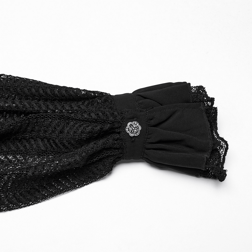 Close-up of gothic black lace ruffled sleeve with delicate lace buckle and vintage rose detail.