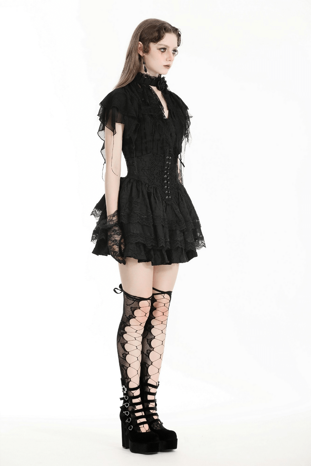 Gothic black lace trim blouse with ruffled sleeves, button-down front, and high-neck collar, paired with stylish thigh-high boots.