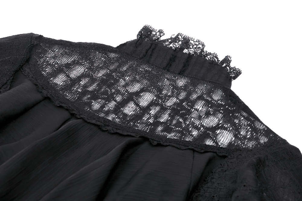 Close-up of the intricate black lace detail and high-neck collar on a Gothic blouse with ruffled sleeves.