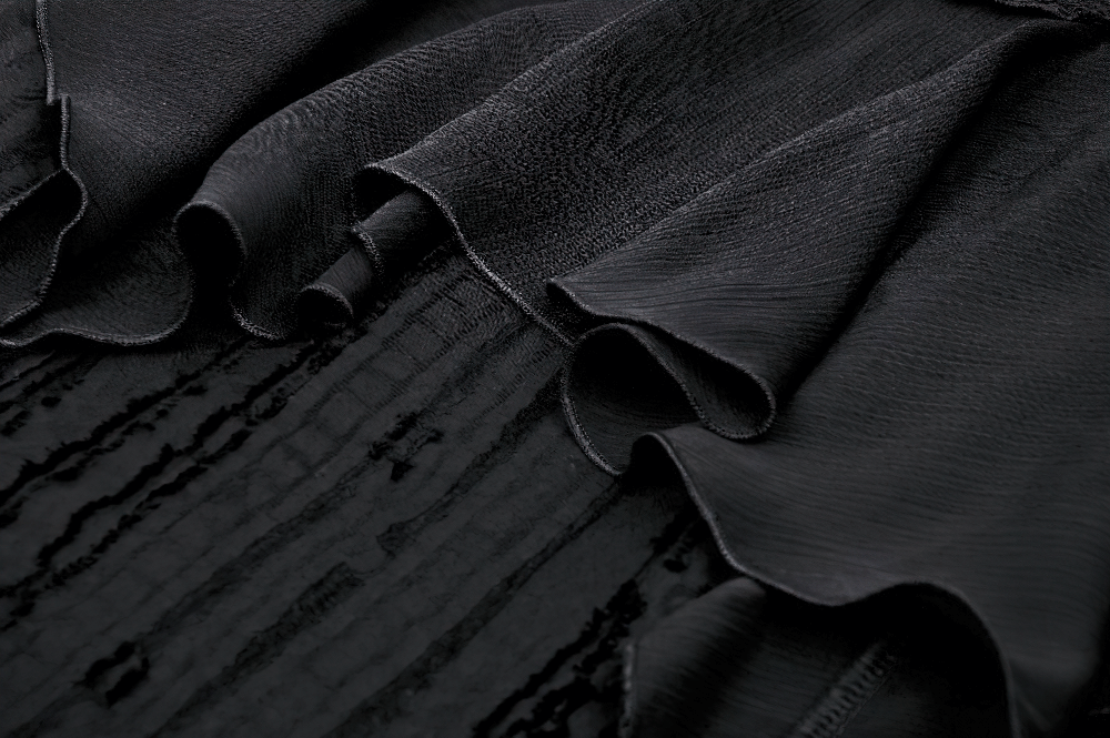 Close-up of elegant black lace trim and ruffled fabric, showcasing intricate details perfect for Gothic fashion.