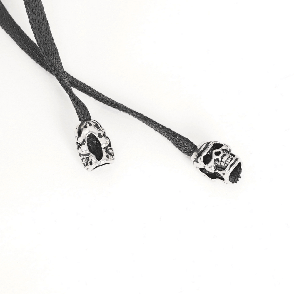 Gothic skull-accented lace ends for unique alternative fashion accessories.