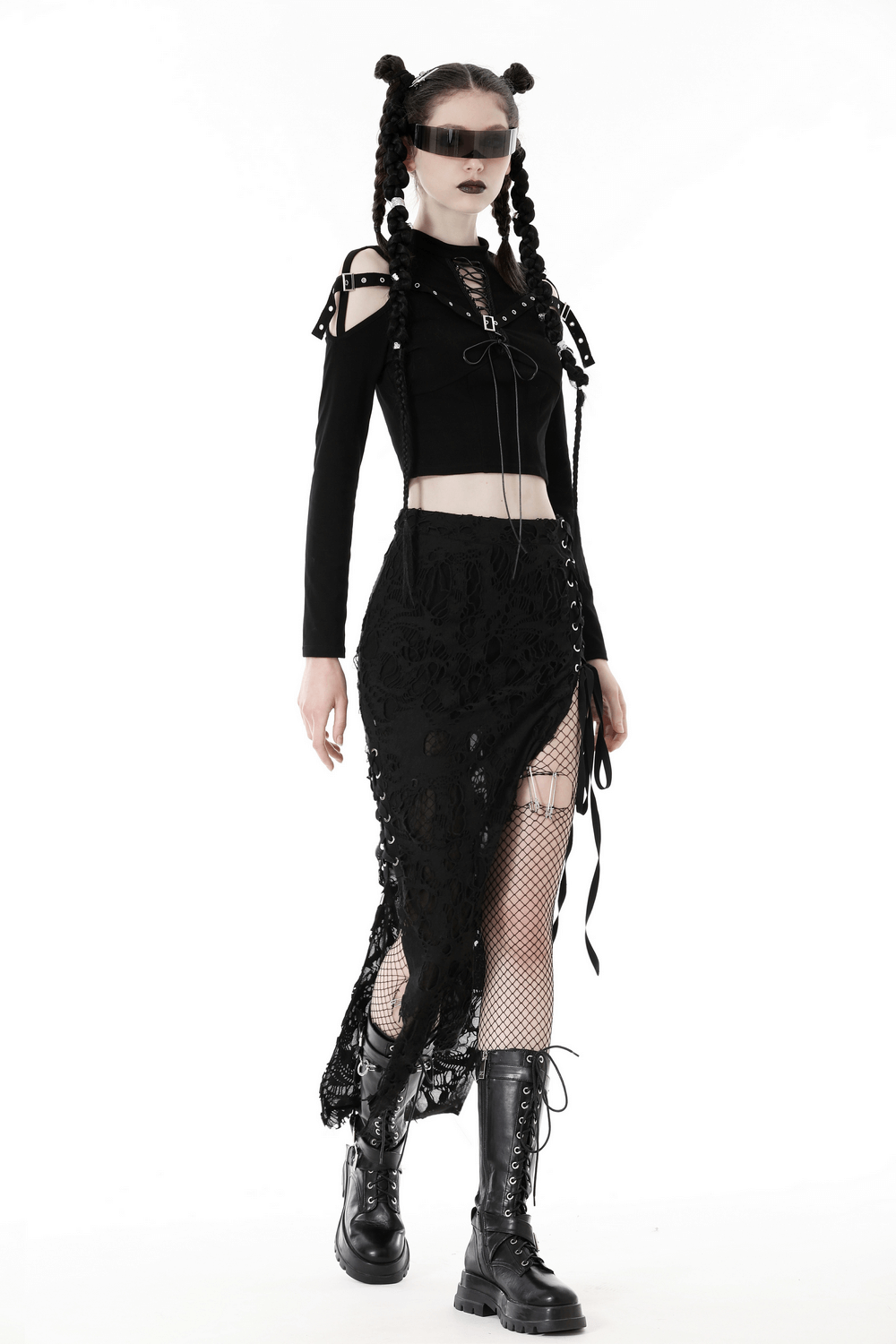 Gothic black lace-up crop top with cut-out details paired with a long black skirt and combat boots for an edgy look.