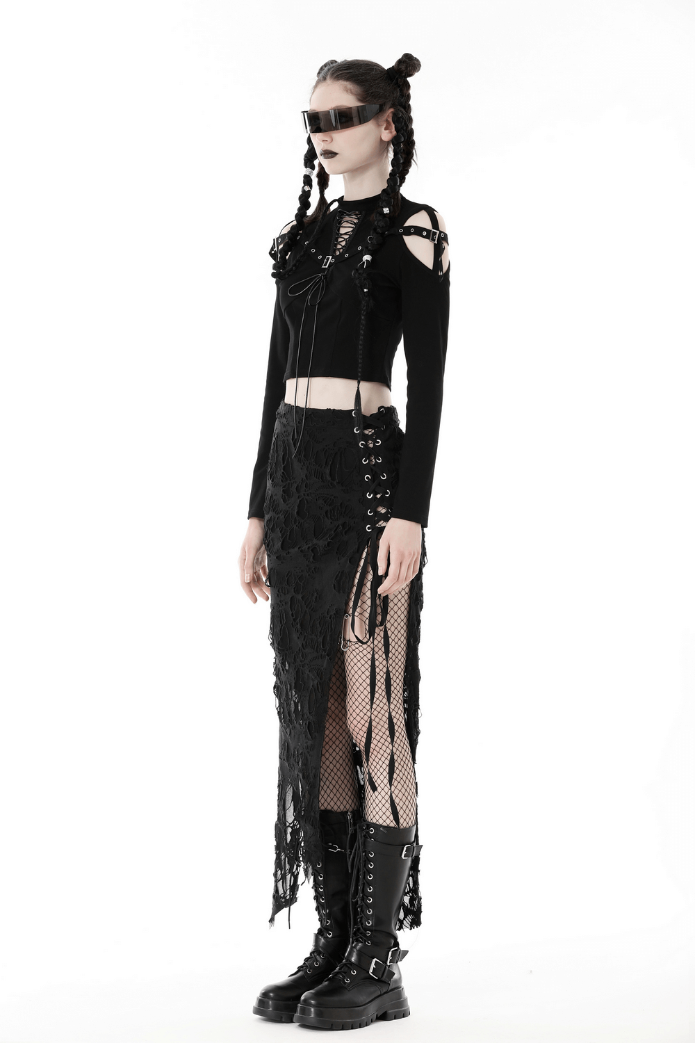 Gothic black lace-up crop top with cut-out details and strappy shoulders, paired with a dramatic black lace skirt.