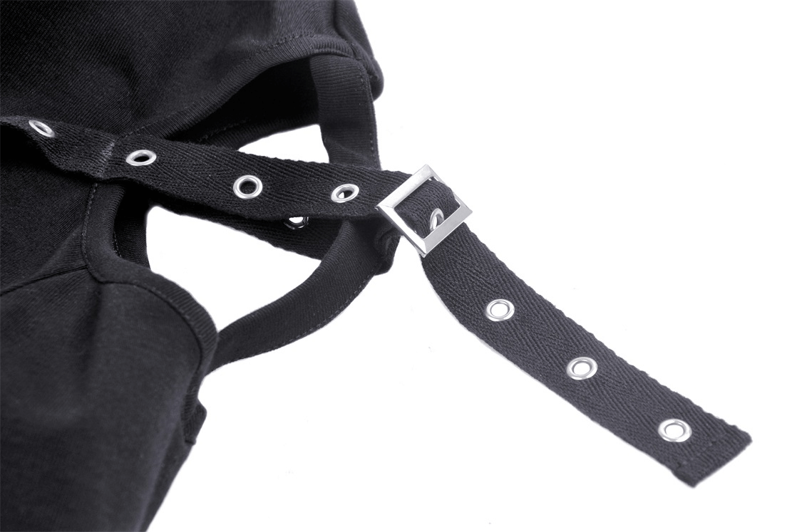 Close-up of black lace-up details with strappy design on gothic crop top, showcasing edgy fashion elements.