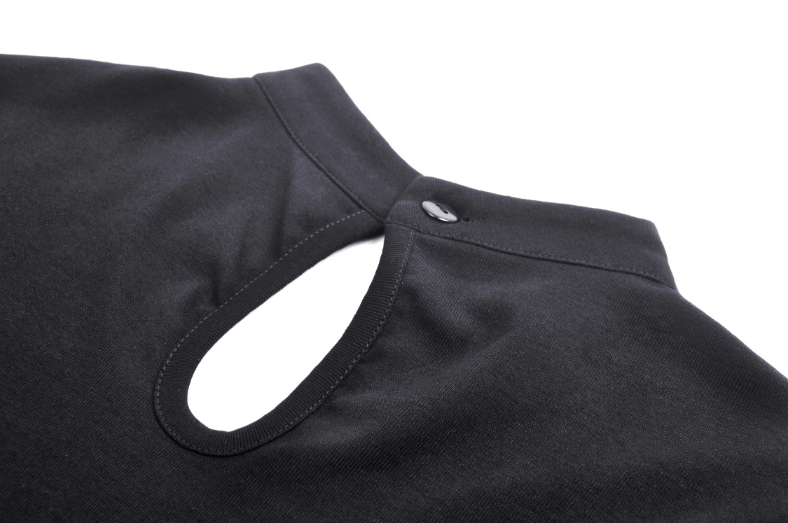 Close-up of gothic black lace-up crop top with cut-out shoulder detail, showcasing its edgy design and fabric texture.