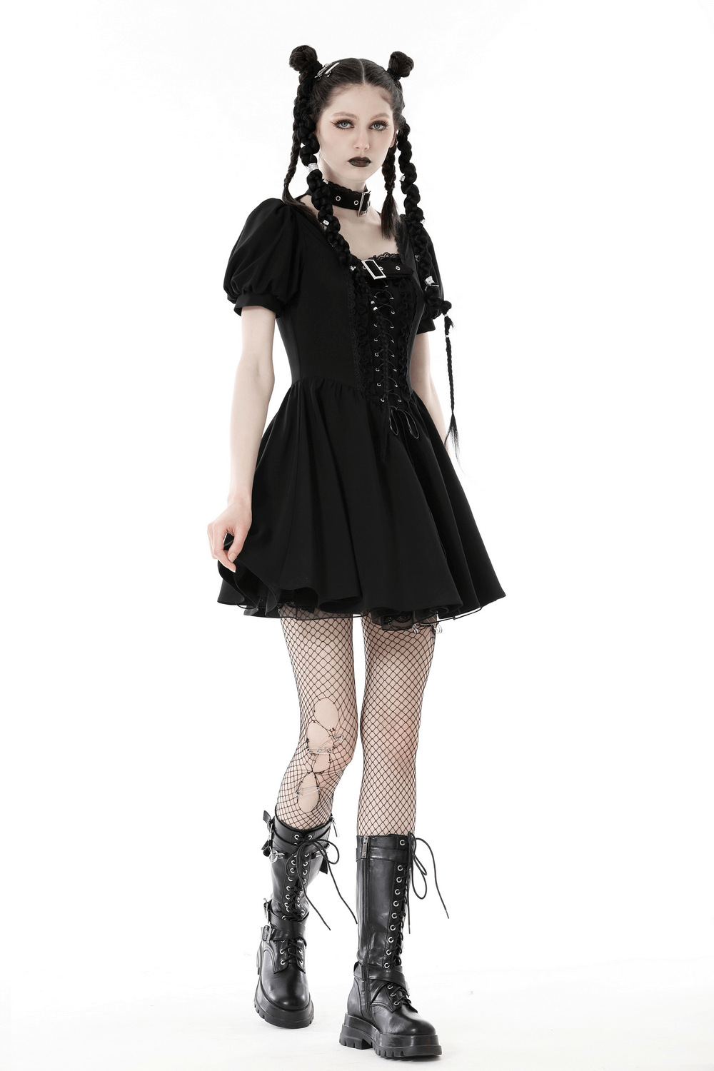 Gothic black mini dress with puff sleeves, lace-up detail, and choker, paired with fishnet tights and combat boots.