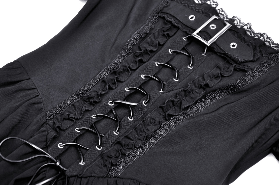 Close-up of Gothic black lace-up dress detailing with ruffles and a buckle, showcasing dark elegance.