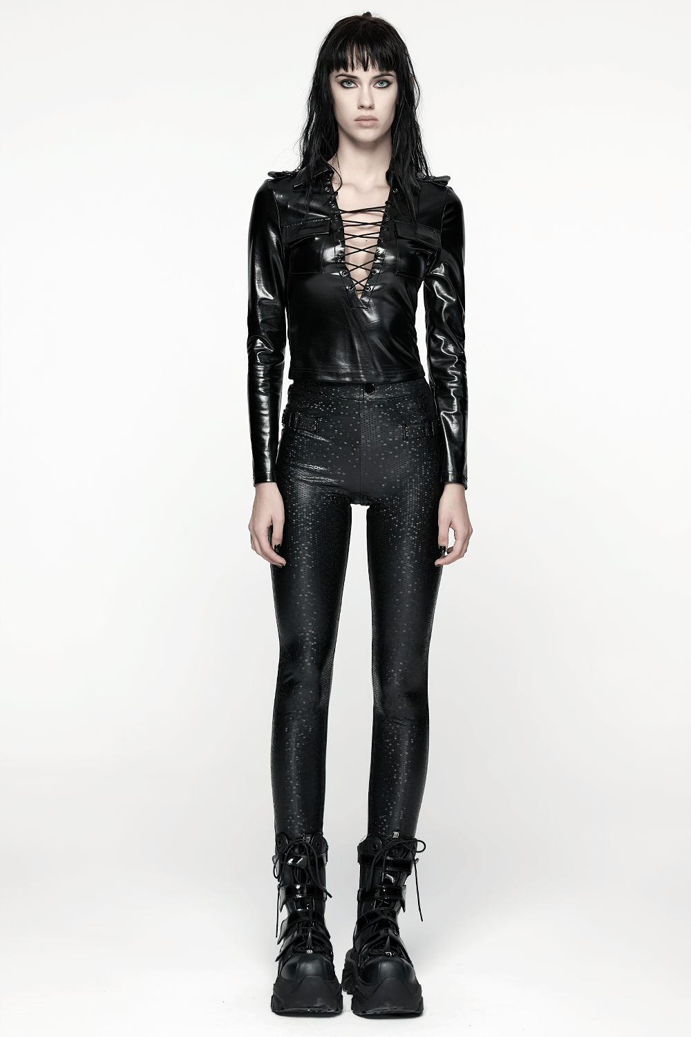 Gothic Black Lace-Up Faux Leather Long Sleeve Top worn with shiny leggings and edgy boots, styled for punk fashion.
