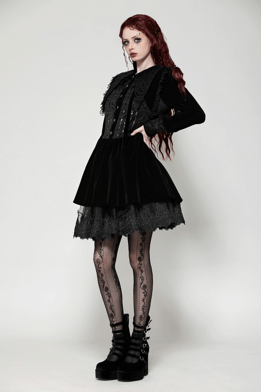 Gothic black lace velvet dress with button details, featuring lace-trimmed cuffs and flowing silhouette, perfect for Victorian-inspired style.