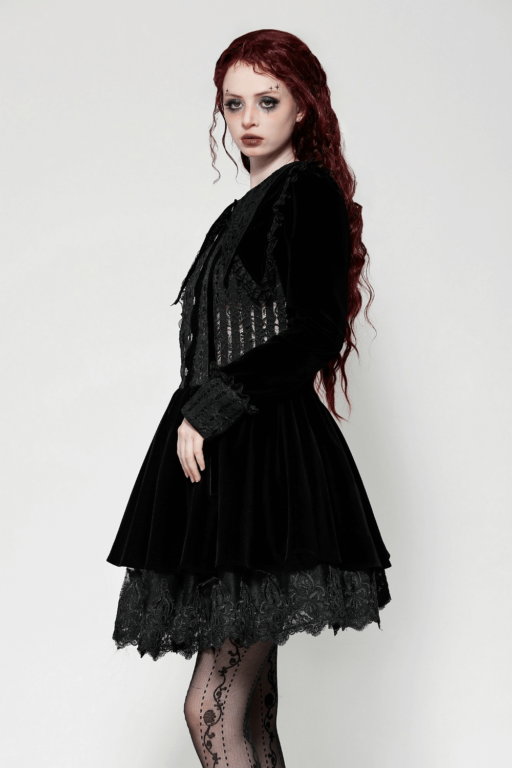 Gothic black lace velvet dress with button details, featuring structured bodice and flowing silhouette, perfect for Victorian-inspired looks.