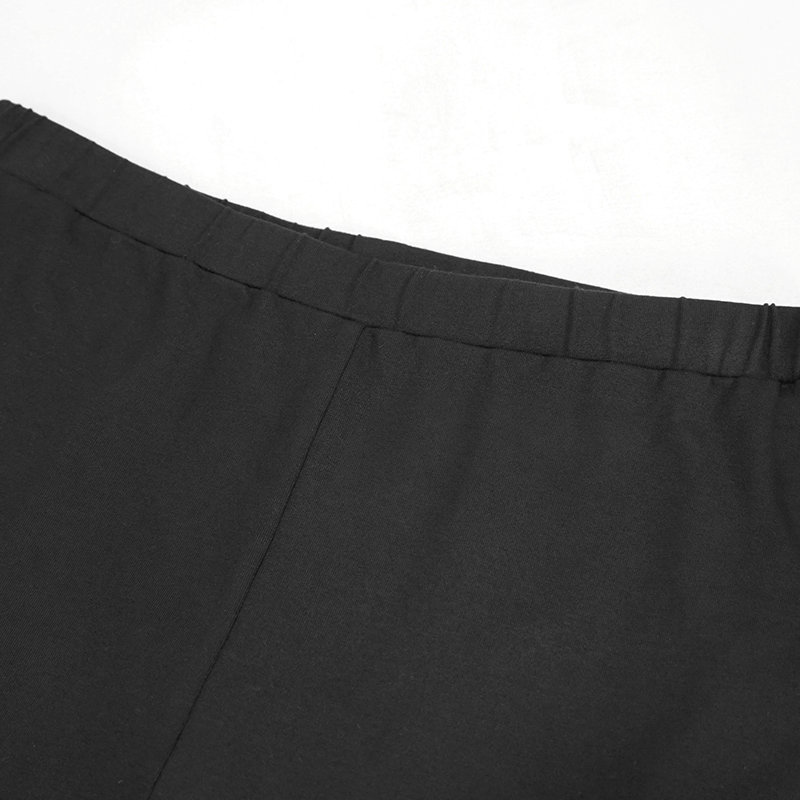 Close-up view of the waistband of black gothic leggings for women with a comfortable elastic fit.