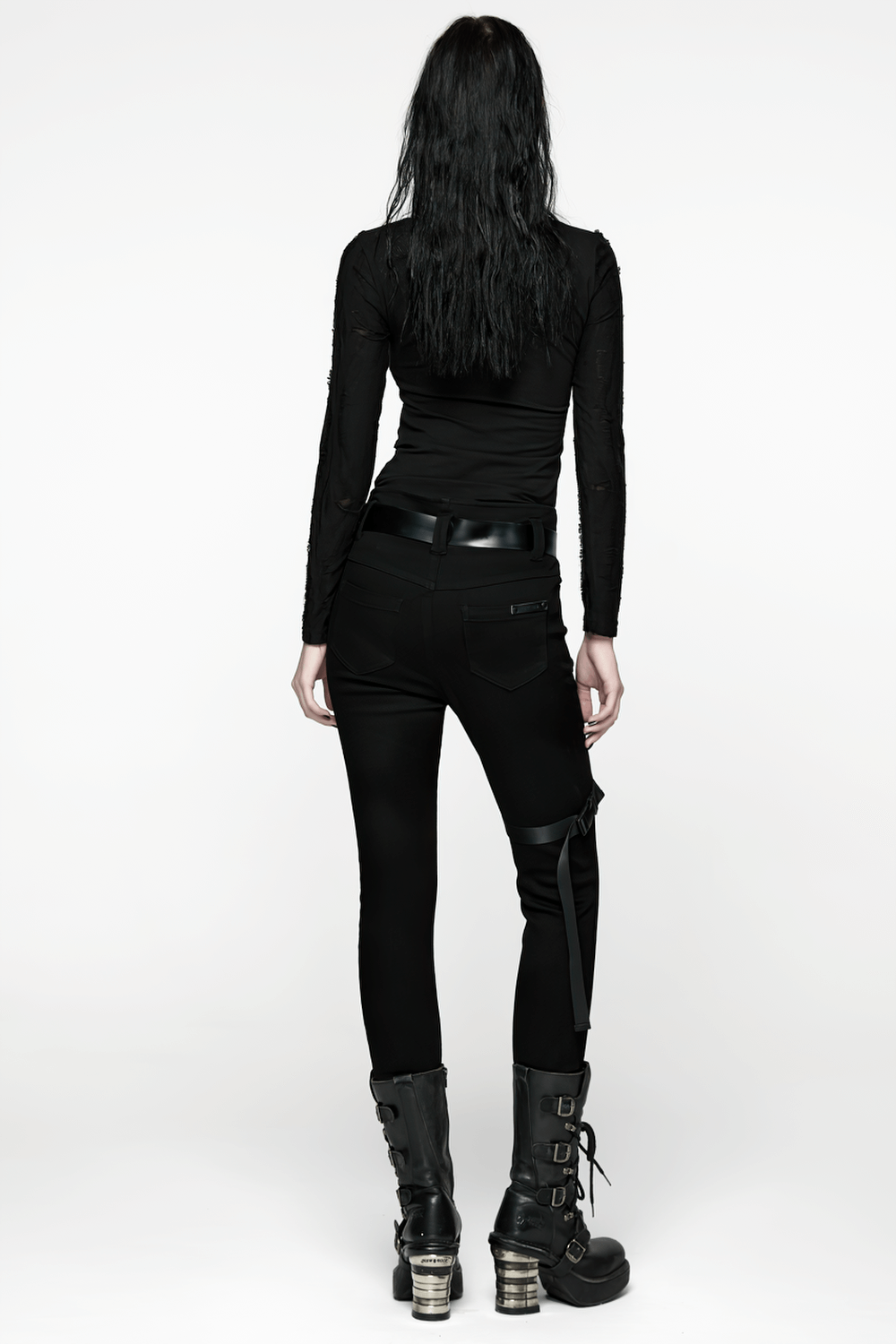 Gothic Black Long Sleeve Top with Buckle Chest Detail worn by model from the back with black punk pants and boots.