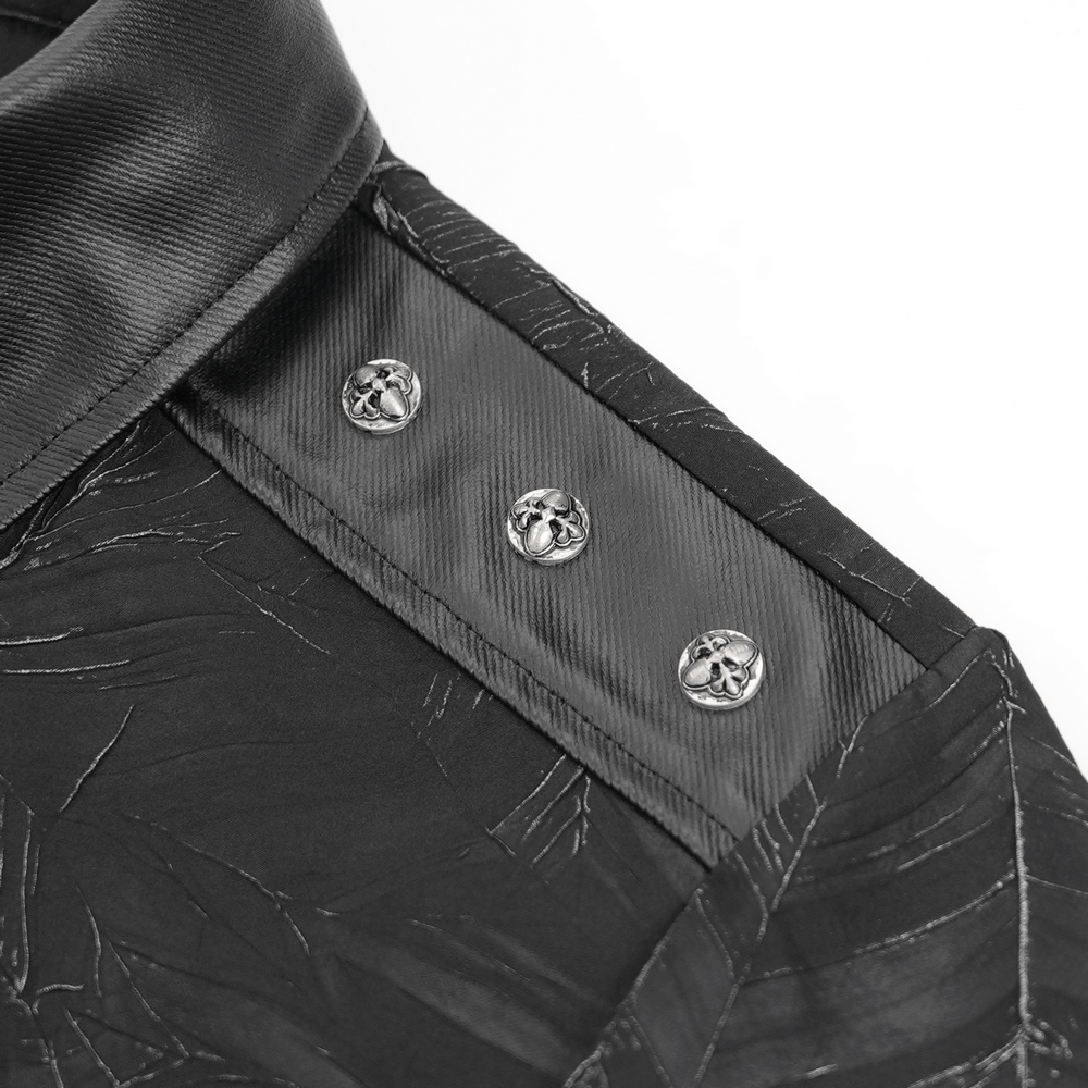 Close-up of gothic black shirt collar with silver skull buttons and intricate textured fabric details.