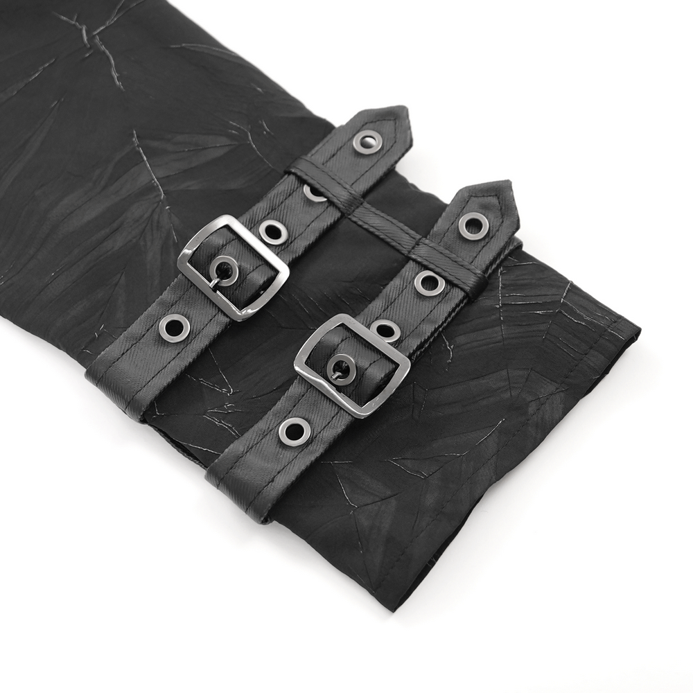 Close-up of adjustable buckles on the cuffs of a Gothic black long-sleeved shirt with leather accents.