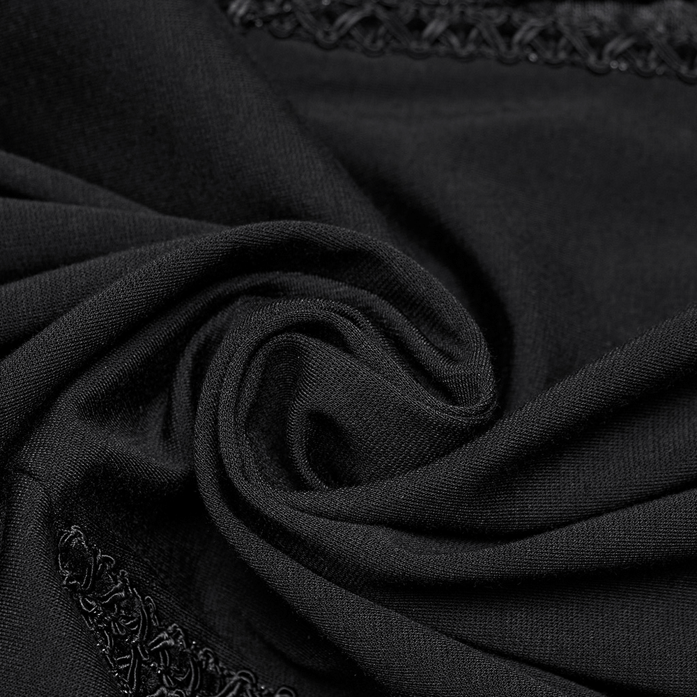 Close-up of sleek black fabric showcasing intricate lace detailing for a Gothic black maxi dress.