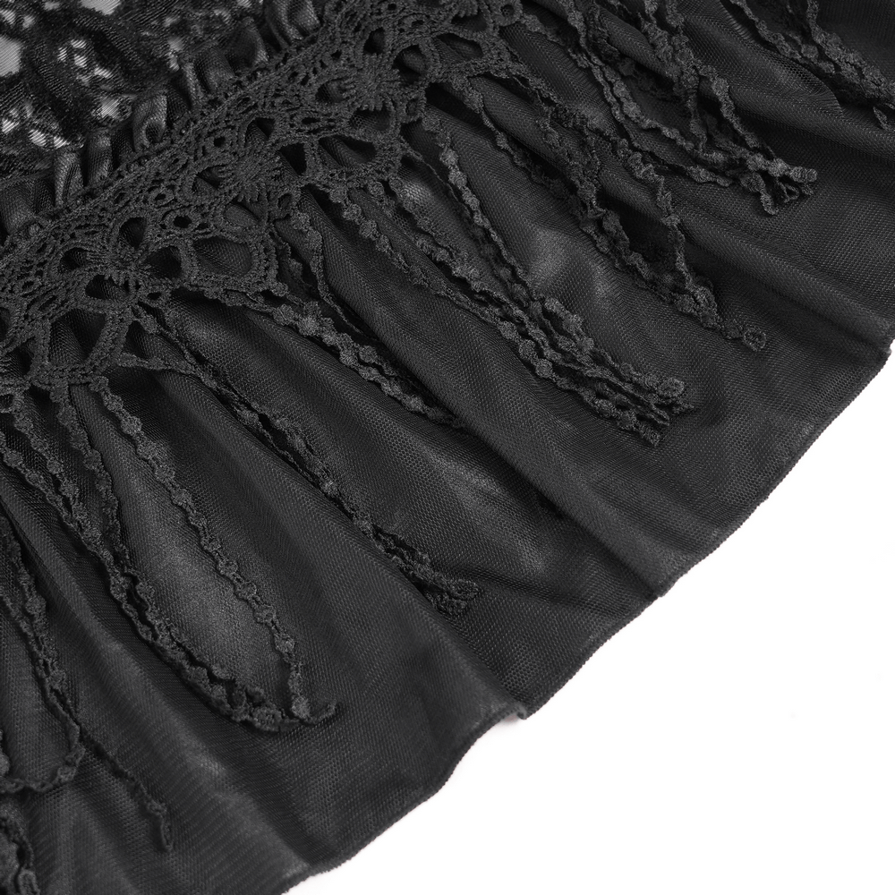 Close-up of intricate black lace and ruffled detailing on a gothic maxi skirt, showcasing elegant texture and design.