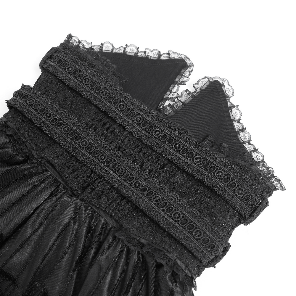 Close-up of gothic black maxi skirt lace and corset waist detailing showcasing intricate lace and textured fabric.