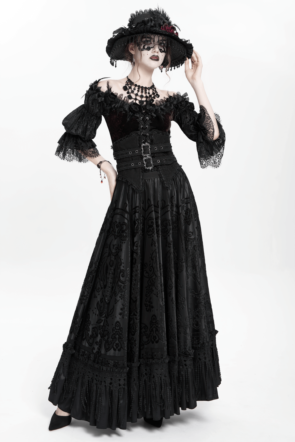 Victorian-inspired Gothic black maxi skirt with lace overlay and corset waist, styled for a dramatic look.