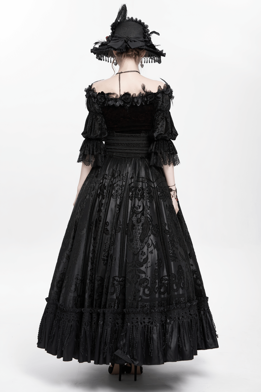 Elegant black gothic dress with lace details and a matching hat, showcasing a regal Victorian-inspired silhouette.