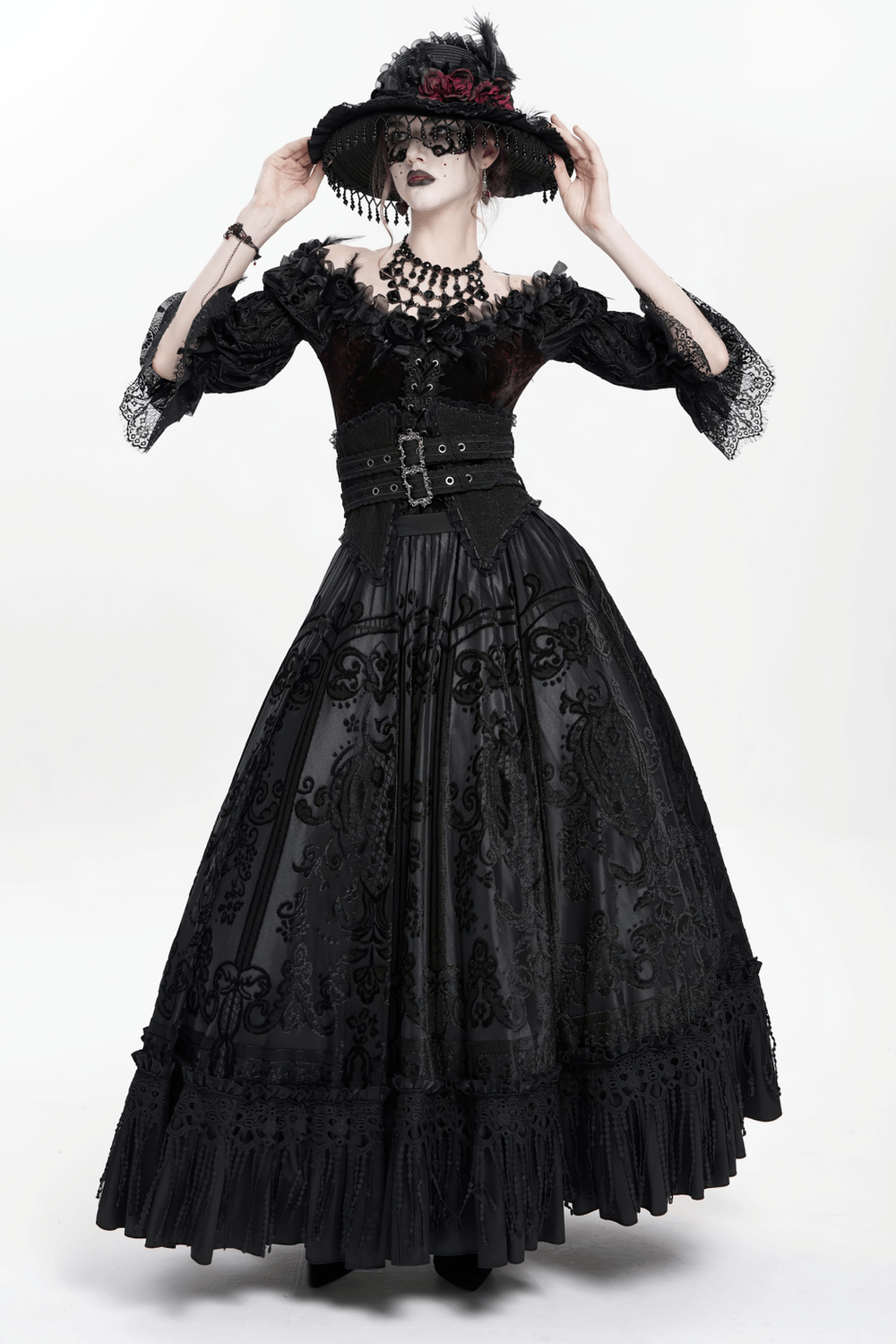 Gothic black maxi skirt with lace overlay and corset waist, styled for a Victorian-inspired look.