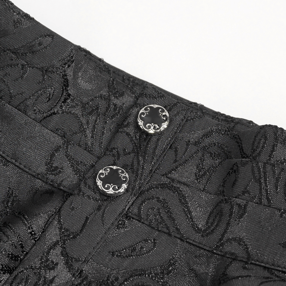 Close-up of decorative buttons on a gothic black men's shirt, showcasing intricate designs and luxurious fabric.