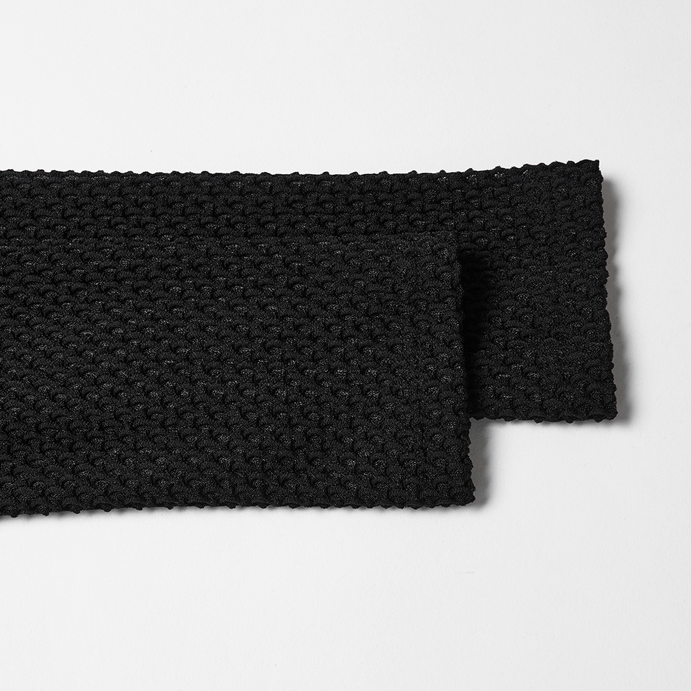 Gothic Black Mesh Dress with Rivet Waist and Layered Hem details showing textured fabric and design elements.