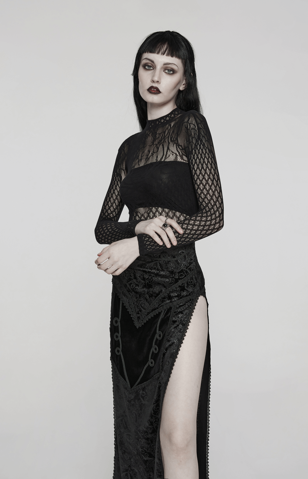Gothic black mesh dress with vine lace details, featuring a fitted silhouette and an alluring high slit for dark elegance.