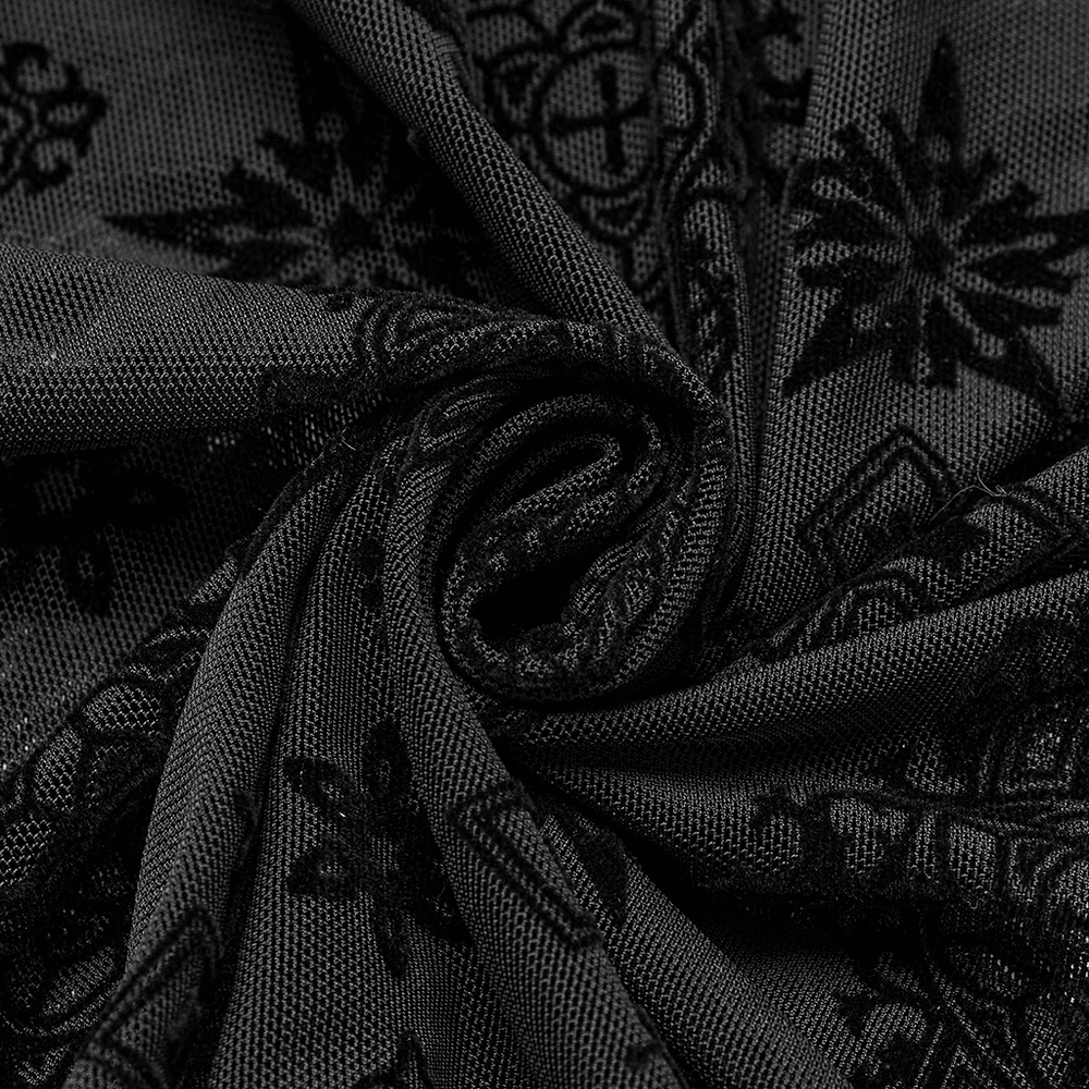 Close-up of gothic black mesh fabric with intricate cross embroidery, showcasing its retro design and textured pattern.
