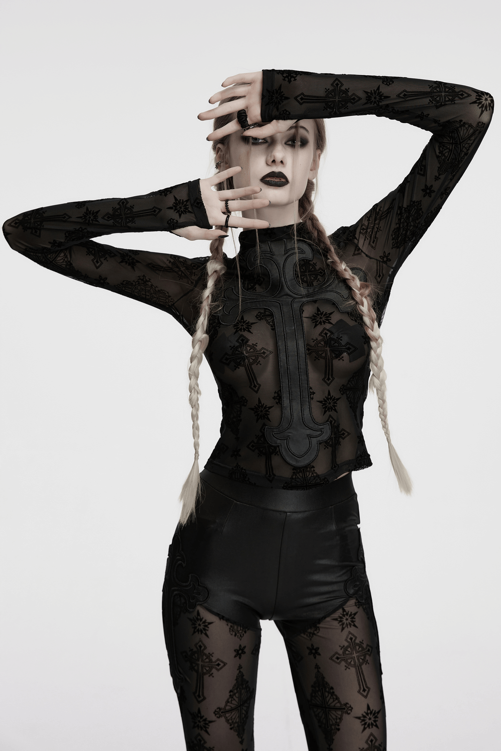Gothic black mesh long sleeved top with cross embroidery, styled for a striking retro look.
