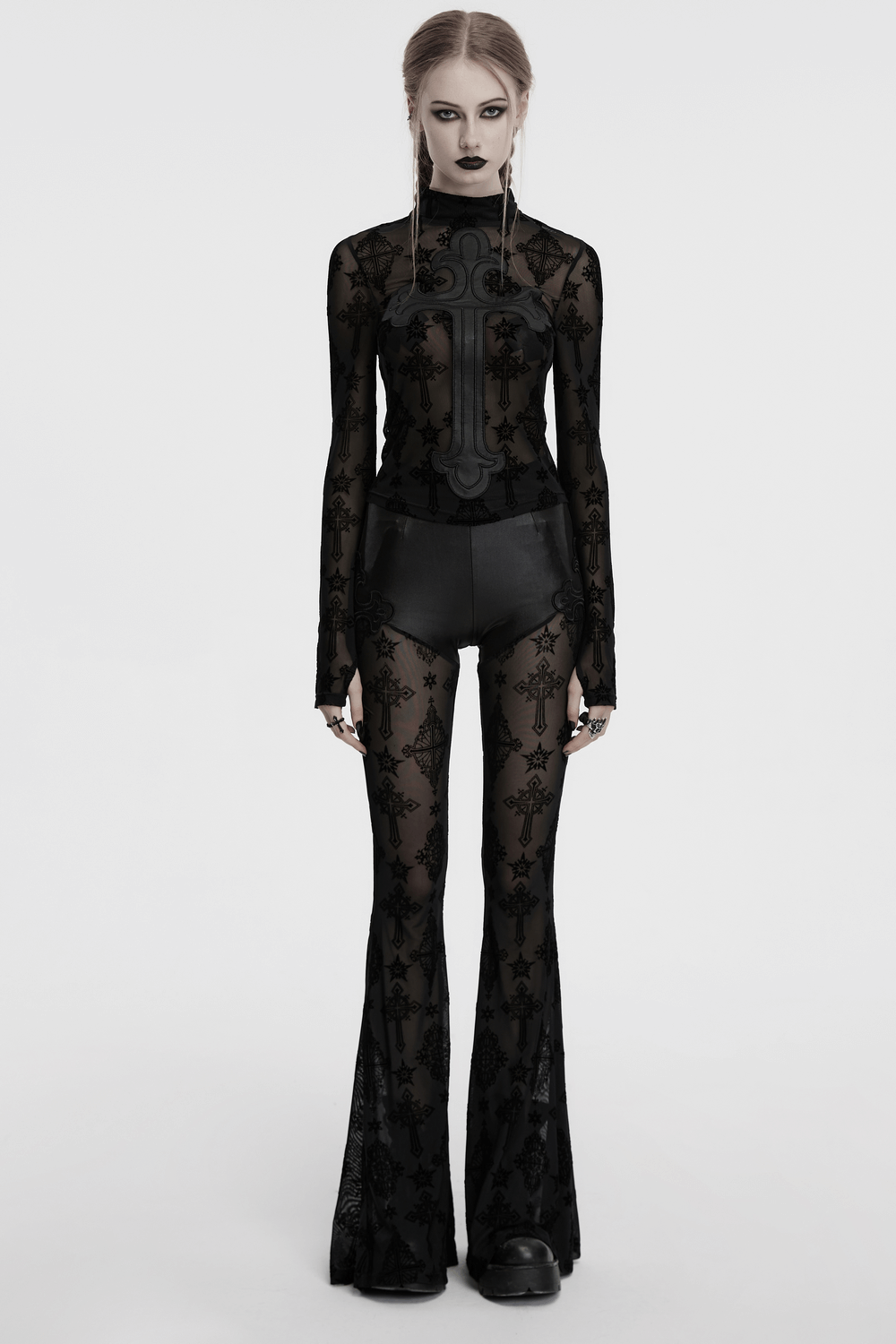 Gothic black mesh long sleeved top with cross embroidery, paired with matching flared pants for a retro gothic look.