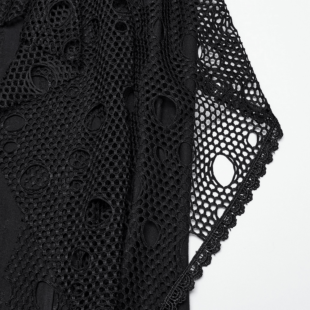 Close-up of gothic black mesh fabric with intricate perforated details for a punk-style maxi skirt.