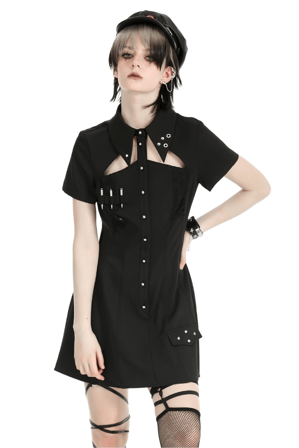 Gothic black mini dress with metal studs, cut-out design, and pockets, perfect for edgy fashion statements.