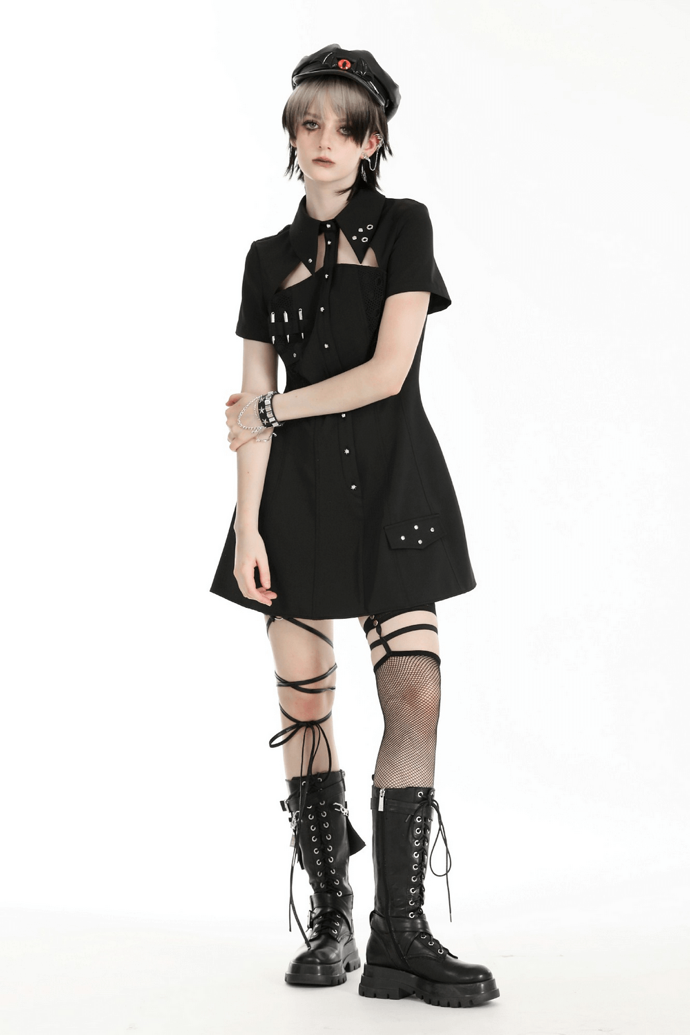 Gothic black mini dress with metal studs, pockets, and short sleeves, perfect for edgy fashion statements.