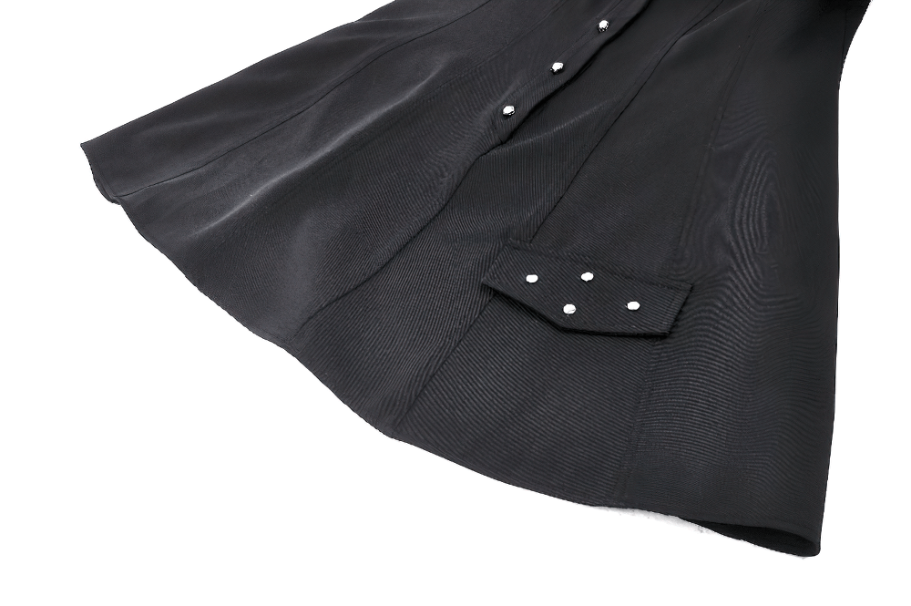 Close-up of black mini dress with metal studded pocket and elegant sleek fabric for gothic fashion lovers.
